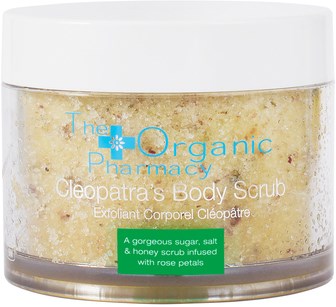 En burk med Cleopatra's Body Scrub med vit lock, gulaktig skrubb och blått och grönt märke.