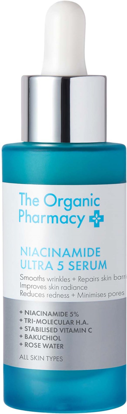 En teal-flaske med hvit pipette-top merket 'Niacinamide Ultra 5 Serum' fra The Organic Pharmacy. Den gir hudpleiefordeler.