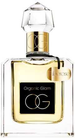 En parfyllflaska märkt "Organic Glam" med ett gyllene band och ett klart, fasetterat lock.