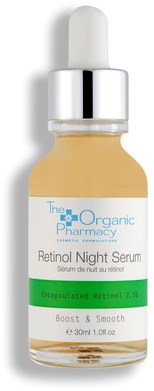 En liten flaska med pipett, märkt 'Retinol Night Serum,' grön och vit design, innehåller hudvårdsprodukt.