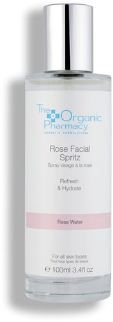 En klar flaska med rosespray från The Organic Pharmacy, med silverlock och vit etikett, för alla hudtyper.