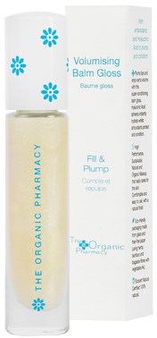 En vit tub och box med blå blommor och text, visas en läppglansprodukt från The Organic Pharmacy.