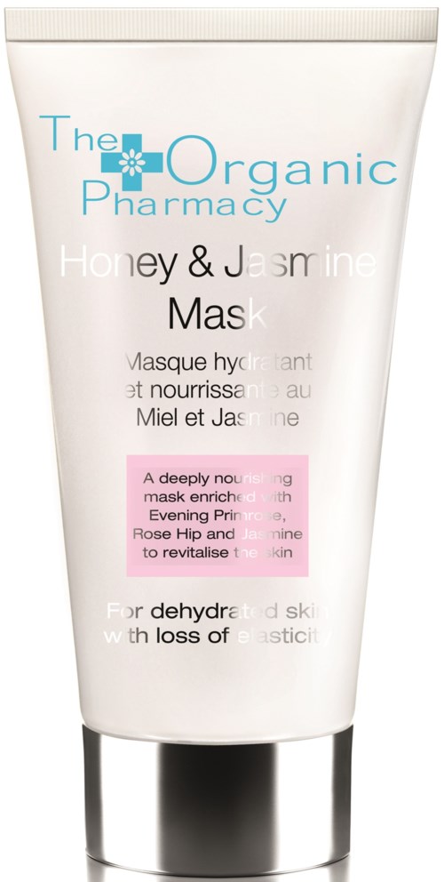 En hvit tube med ansiktsmaske med blå og rosa tekst, som promoterer honning, jasmin og naturlige ingredienser for hudpleie.