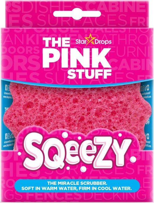 Pink sponge with branding for a cleaning product, called Squeezy, that stays firm in cool water.