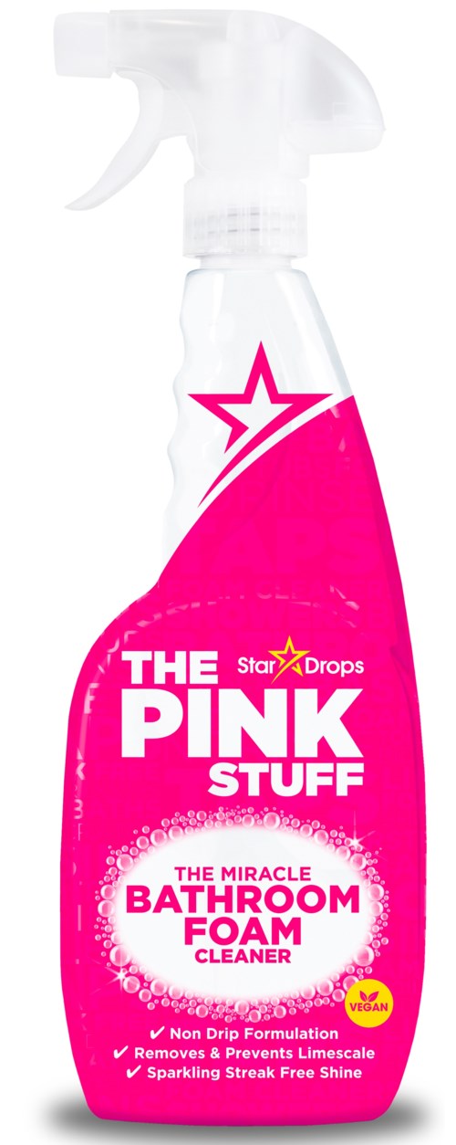 En rosa sprayflaske merket The Pink Stuff badrumsskumrenser, med en hvit spraymunnstykke og stjerneg. logo.