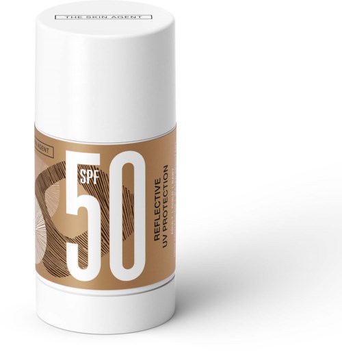 Zonnebrandstick met SPF 50, gelabeld als reflecterend en onbeschermd, in een witte en gouden container.