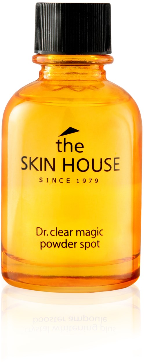 En liten orange flaska med svart lock, innehållande en hudvårdsprodukt som heter Dr. clear magic powder spot.