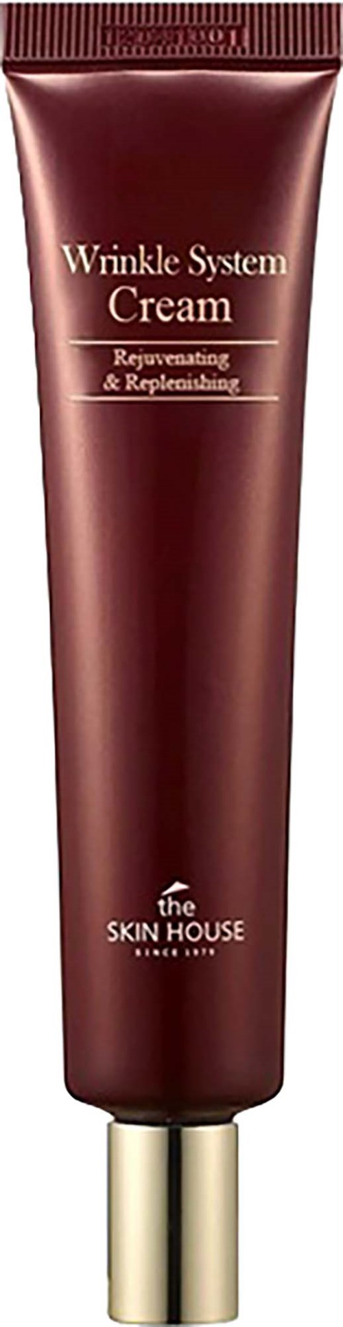 En brun tub med guldlock, märkt Wrinkle System Cream av The Skin House, för att föryngra och minska rynkor.