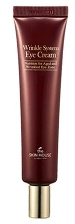 En brun tub med ögonkräm och guldkork, märkt 'Wrinkle System Eye Cream.'