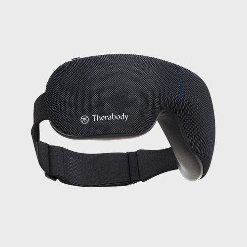 Musta päänauha, jossa pehmuste, merkinnällä 'Therabody', tarkoitettu terveyteen tai rentoutukseen.