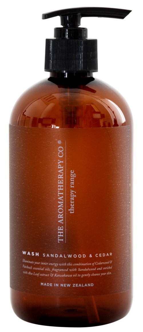 A brown bottle with a black pump contains wash sandalwood and cedar scent. The label says it's made in New Zealand.