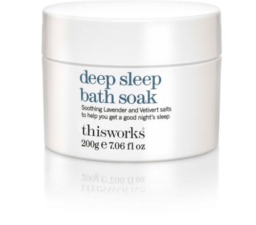 A white jar labeled 'deep sleep bath soak' with lavender and salts for better sleep.