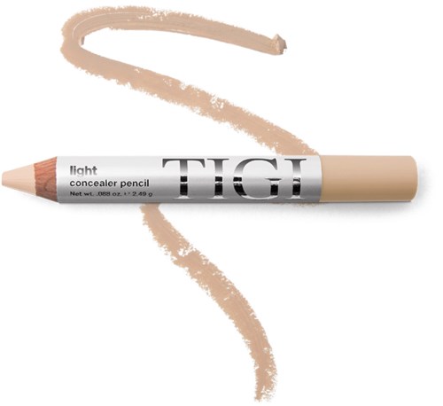 En beige concealer-penna med svart och vit etikett, som skapar en ljusbrun slingrande linje på vit bakgrund.