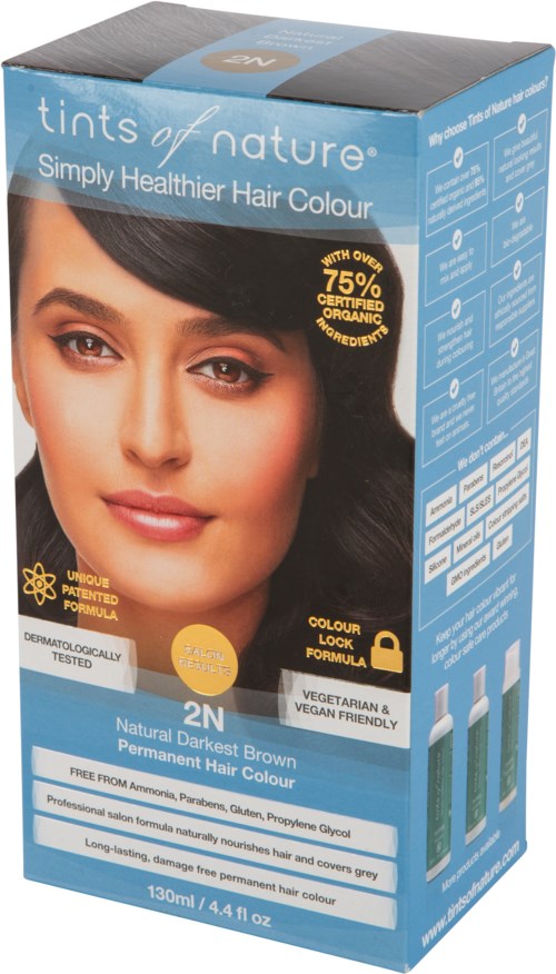 Blue hair dye box with a woman's face, highlighting natural dark brown color, cruelty-free, vegan, with organic ingredients.
