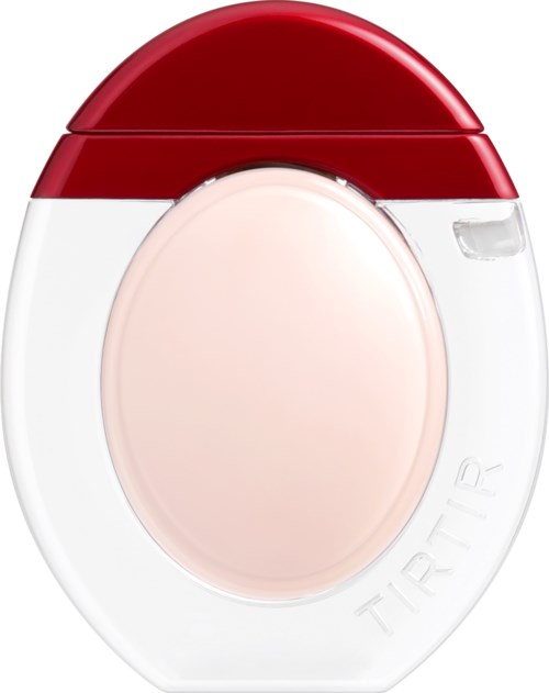 A small device with a red top and white body, possibly a container or alarm. It has a round light or button.