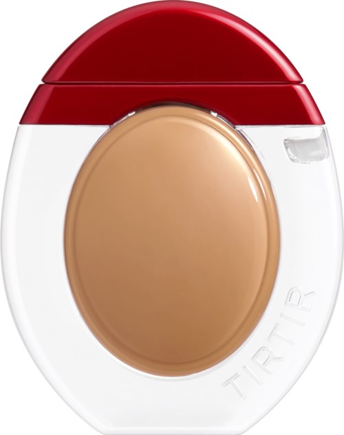 Round container with a red lid and beige center, labeled TIR TAR, likely a makeup or cosmetic product.