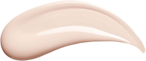 En svep av beige krämgelé med glänsande, slät yta och buktig form, på svart bakgrund.