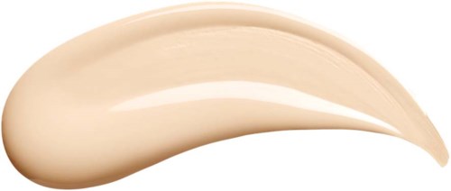 Een beige vlek van crème of lotion met een gladde, gebogen vorm op een witte achtergrond.