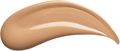 En klick av beige tonat liquid makeup eller hudvårdsprodukt, med en slät, kurvig form.