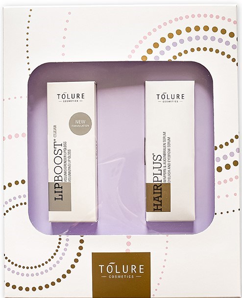 Two Tölure cosmetic products in a decorative box, one labeled "Lip Boost" and the other "Hair Plus."
