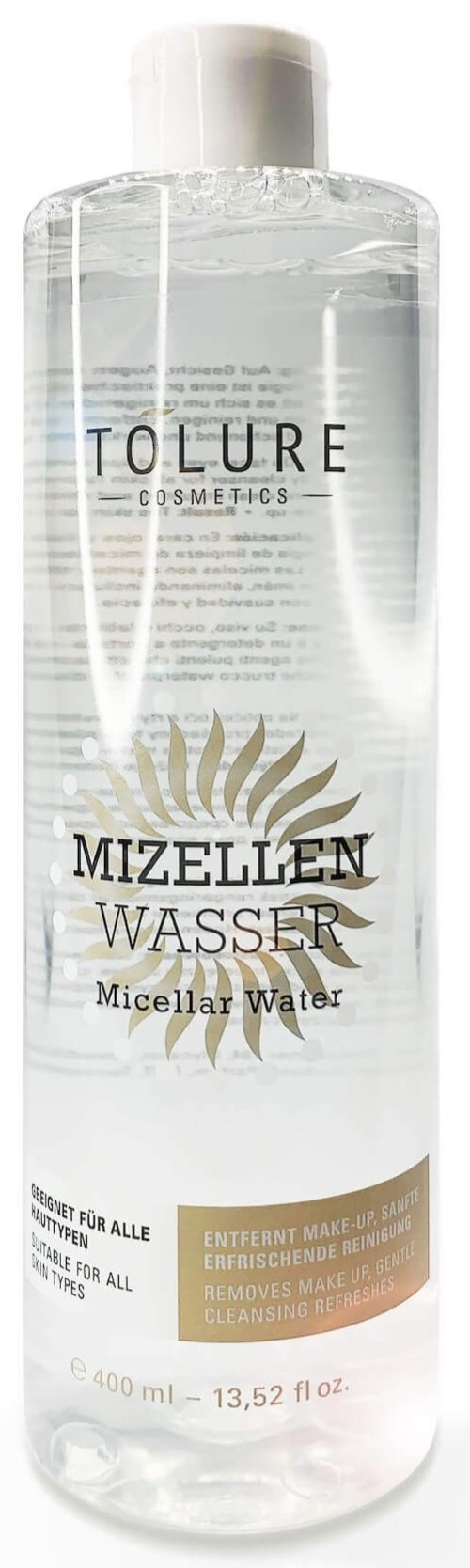 Selkeä pullo Tolure Cosmeticsin micellar vettä, jossa on kultainen ja valkoinen etiketti ja valkoinen korkki.