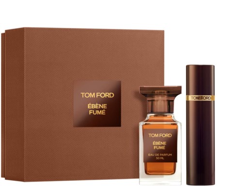 En parfayset med en brun låda, en parfymflaska och ett cylindriskt behållare, alla märkta Tom Ford Ébène Fumé.
