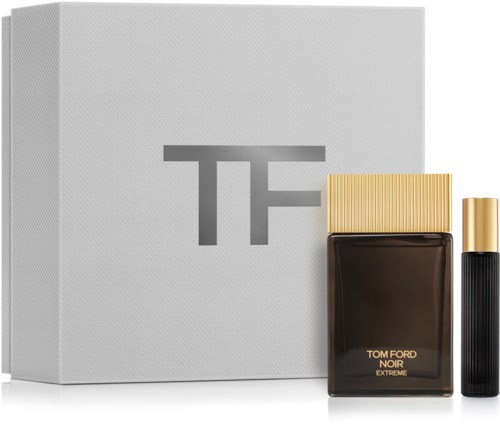 A gift set with a grey box, a black perfume bottle labeled "Tom Ford Noir Extreme," and a small black and gold spray.