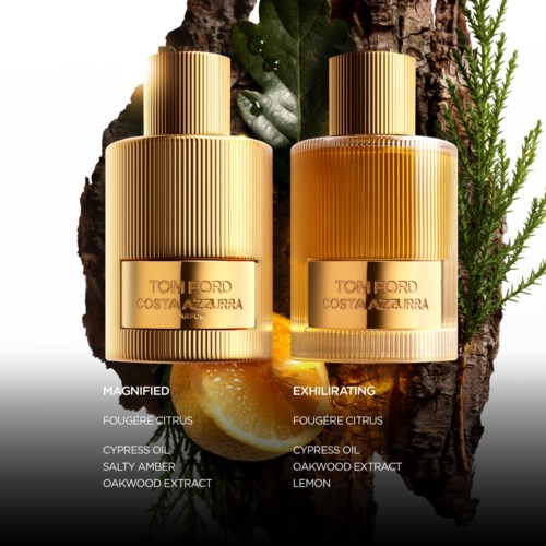 To parfymflasker udendørs med naturmaterialer som citron, blade og træbaggrund, mærket 'Magnified' og 'Exhilarating'.