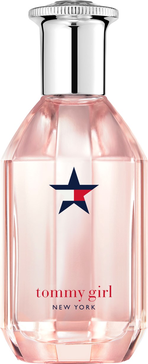 Butelka perfum z różową cieczą, srebrną nakrętką i logiem w kształcie gwiazdy. Etykieta mówi "tommy girl NEW YORK."