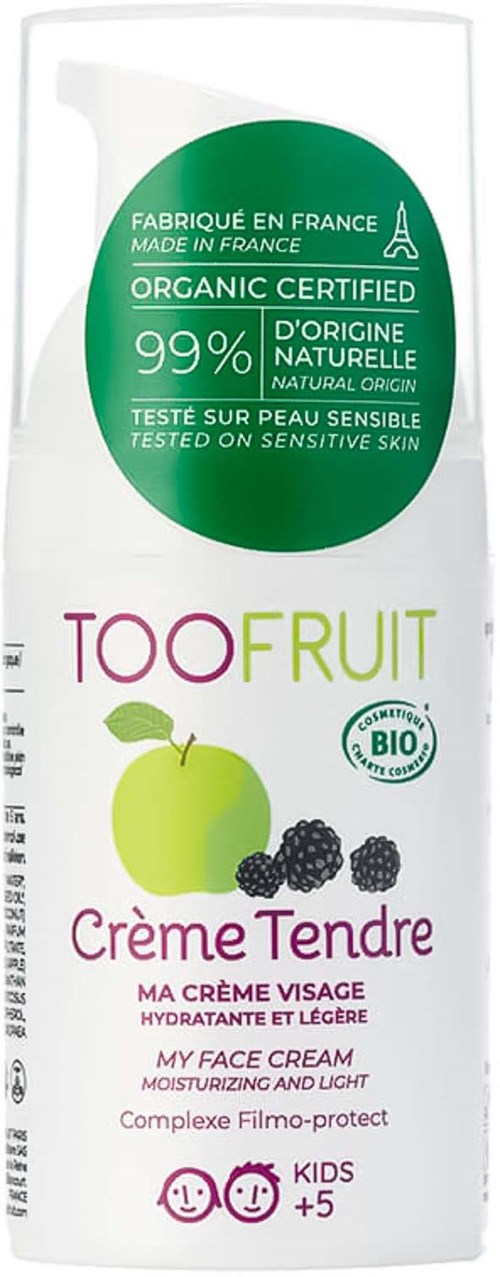 En hvit tube med ansiktskrem merket 'TOOFruit Creme Tendre' med grønn og lilla tekst, et eple og bjørnebær, og 'Kids +5'.