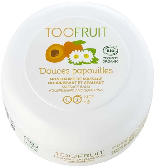 En hvid beholder mærket 'TOOFruit' med abrikos og kamille blomster, angiver nærende og beroligende salve til børn.