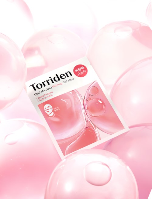 A pink sheet face mask surrounded by pink bubbles or balls, with the box label visible in the center.