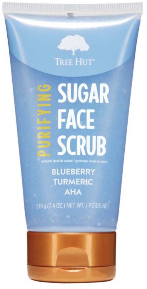 Blauwe tube met witte boomlogo en witte en gele tekst voor gezichtsscrub ingrediënten en merk.