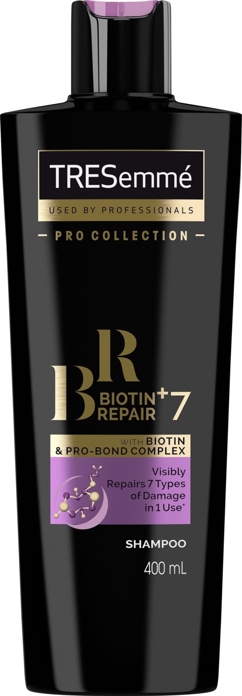 En svart schampoflaska med lila lock, märkt TRESemmé Pro Collection Biotin Repair, 400 mL.