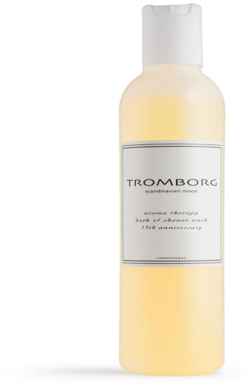 En hvid og gul flaske mærket 'TROMBORG' med hvid lås, sandsynligvis kropp- eller brusebad.