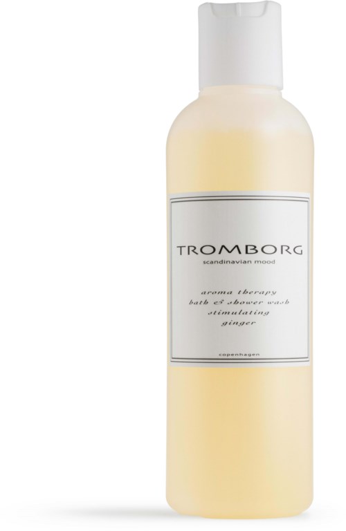 En hvid flaske med etiket, indeholder aromaterapi bad- og shower wash med ingefærduft.