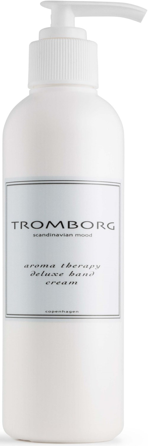 En hvid flaske med pumpe, mærket Tromborg aroma therapy deluxe hand cream.
