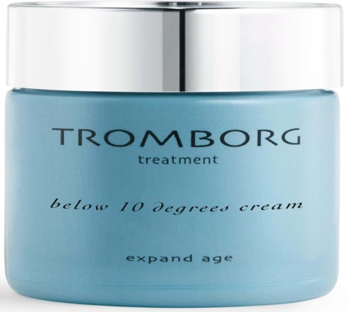 En blå beholder med sølv låg mærket Tromborg behandling, under 10 grader creme, til hudpleje.