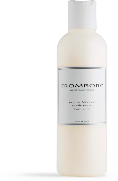 En vit flaska med en enkel etikett visar märket Tromborg och en beskrivning av dess doft.