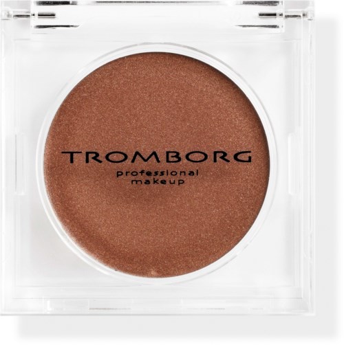 Et rundt makeup-produkt i en gennemsigtig beholder med brunt farve og sort tekst. Den siger "Tromborg" og "professional makeup."