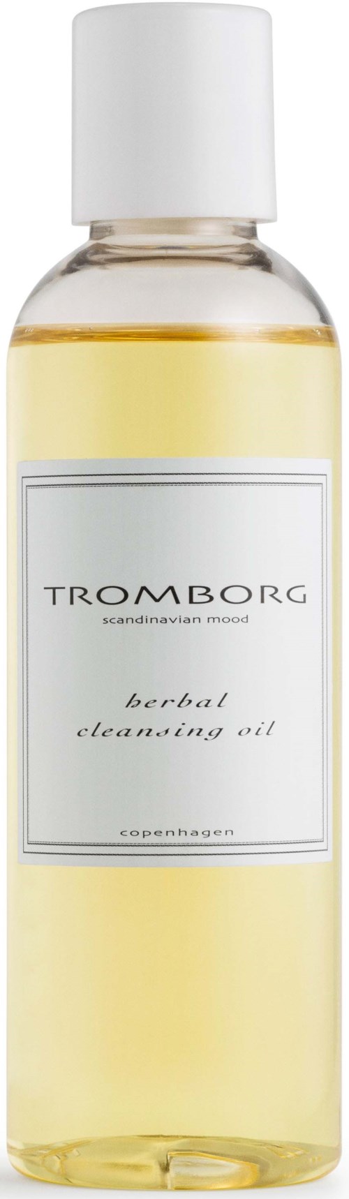 En tydlig flaska med ört rengöringsolja med vit topp, märkt "TROMBORG" och "scandinavian scent."
