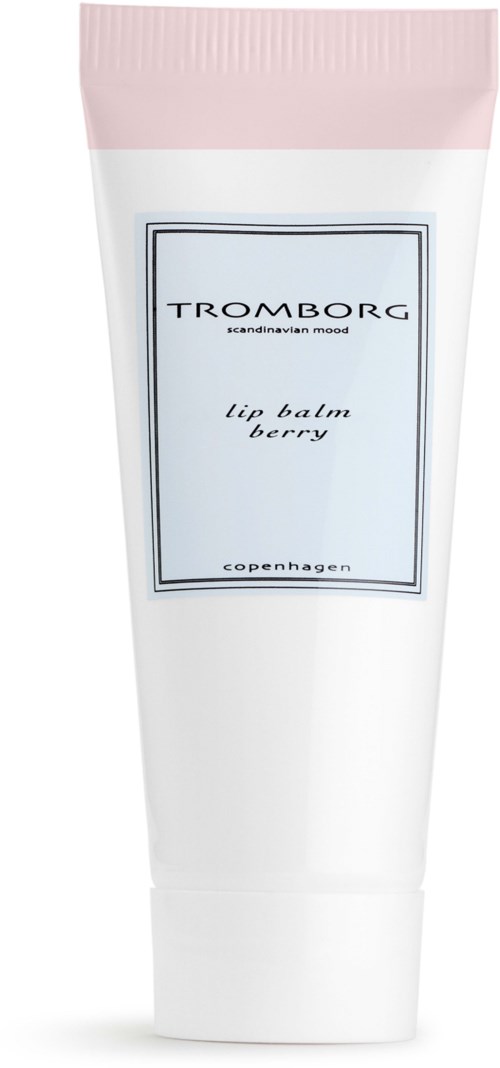 En hvid tube med lyserødt låg mærket Tromborg lip balm berry, lavet i København.