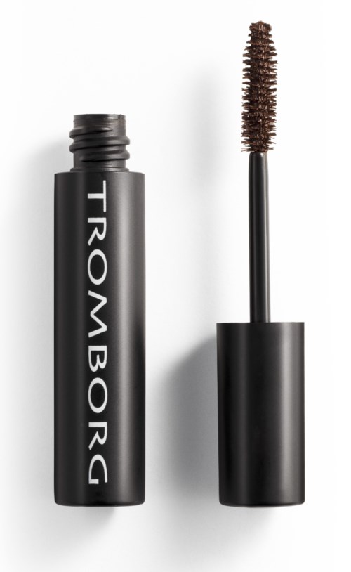 En sort mascara-tube med mærket 'TROMBORC' og en åben børste.
