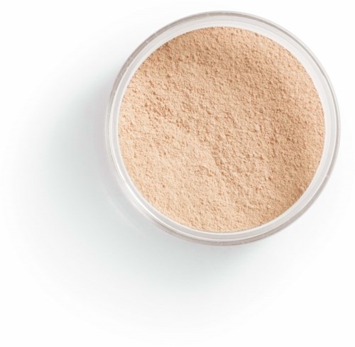 En rund behållare fylld med ljusbeige puder, troligen makeup eller kosmetikprodukt.