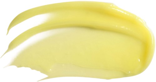 Żółta kremowa warstwa rozsmarowana na białym tle, z trzema śladami pędzla.