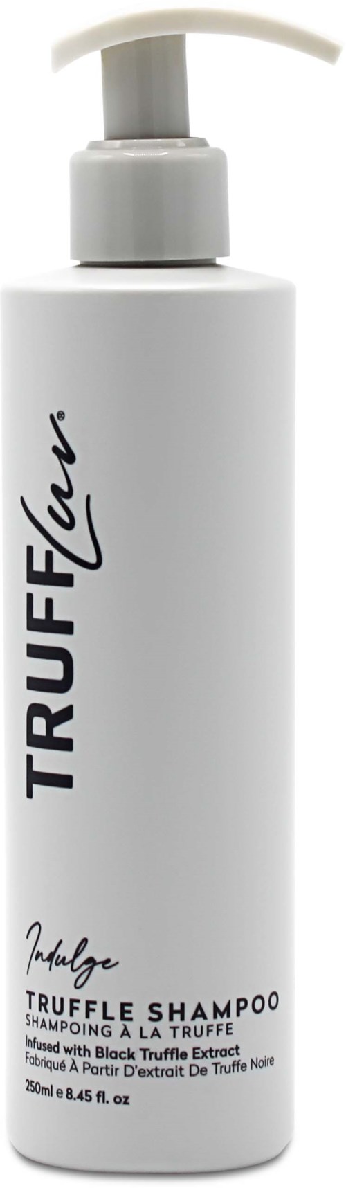 Vit flaska med pump, märkt 'TRUFFLEX' och 'Truffle Shampoo', innehåller tryffelutdrag för hårvård.