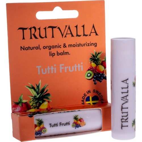 En leppepomade i en hvit tube og oransje eske, med bilder av ulike frukter og merket Trutvalla.