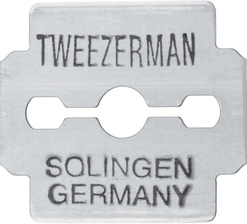 A metal razor blade with the words "TWEezerman" and "SOLINGEN GERMANY" printed on it.