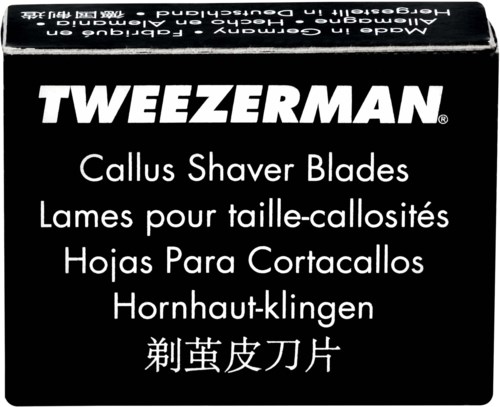 Black box label with white text describes Tweezerman callus shaver blades in multiple languages.