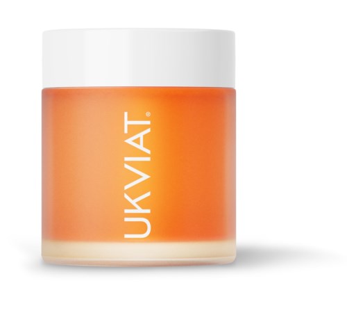 Ett litet burk med vit lock, orange etikett och orange kräm inuti. Etiketten säger "UKVIAT."